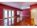 Spacious living room with hardwood floors and a fireplace at 4542 Ne 4Th St, Ocala, FL 34470