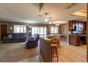Open concept kitchen and living room with light wood floors at 512 Bahia Cir # 512B, Ocala, FL 34472
