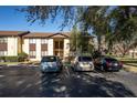 Condo building with cars parked in front at 512 Bahia Cir # 512B, Ocala, FL 34472