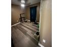 Spacious bedroom with wood-look flooring at 6701 Se 122Nd Ln, Belleview, FL 34420