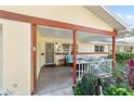 Cozy covered porch with seating, perfect for relaxing outdoors at 8580 Sw 97Th Lane Rd # B, Ocala, FL 34481