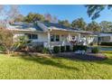 Single-story house with a porch and lush landscaping at 8653 Sw 96Th St # A, Ocala, FL 34481