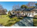 Single-story house with a driveway and landscaping at 8653 Sw 96Th St # A, Ocala, FL 34481