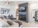 Spacious living room with a modern fireplace and comfortable seating at 4709 Se 25Th Loop, Ocala, FL 34480