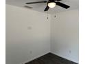 Spacious bedroom with ceiling fan and gray vinyl flooring at 5363 Nw 3Rd St, Ocala, FL 34482