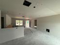 Open living area, under construction, with drywall and concrete flooring at 5411 Nw 7Th Pl, Ocala, FL 34482