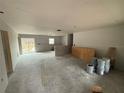 Spacious living room with drywall and exposed flooring at 5411 Nw 7Th Pl, Ocala, FL 34482