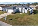 Aerial view of single-story house with a large yard at 5503 Nw 25Th Loop, Ocala, FL 34482