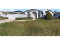 House exterior showcasing a well-maintained lawn at 5503 Nw 25Th Loop, Ocala, FL 34482