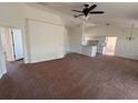 Spacious living room with vaulted ceilings and carpet flooring at 8512 Sw 136Th Pl, Ocala, FL 34473