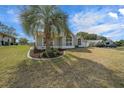 Charming single-story residence showcases a lush lawn and meticulous landscaping, enhancing its curb appeal in the neighborhood at 8822 Sw 108Th St, Ocala, FL 34481