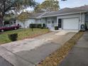 Exterior view showing a house with a driveway and landscaping at 9395 Sw 97Th Ln # B, Ocala, FL 34481