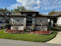 One-story house with a well-manicured front yard at 2011 Se Twin Bridge Cir, Ocala, FL 34471