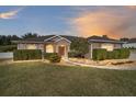 House exterior at dusk showcasing landscaping at 3819 Se 38Th Loop, Ocala, FL 34480