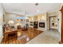 Living room with hardwood floors, fireplace and built-in shelving at 4911 Sw 63Rd Loop, Ocala, FL 34474