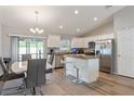 Modern kitchen with stainless steel appliances and granite countertops at 4947 Sw 166Th Loop, Ocala, FL 34473