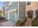 Townhome exterior showcasing garage and front entrance at 4947 Sw 45Th Cir, Ocala, FL 34474