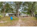 Large backyard with a screened porch and playset at 55 Almond Rd, Ocala, FL 34472