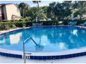 Community pool with ample deck space at 674 Midway Dr # A, Ocala, FL 34472