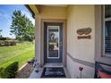 Inviting front entrance with a glass door and personalized house sign at 7617 Sw 96Th Avenue Rd, Ocala, FL 34481