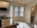 Eat-in kitchen with modern appliances and corner window at 8340 Sw 108Th Place Rd, Ocala, FL 34481