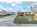 Single-story home with a two-car garage and neat landscaping at 8961 Sw 94Th Ln # C, Ocala, FL 34481