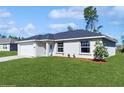 Charming ranch-style house with a spacious front yard and attached garage at 2308 Sw 168Th Loop, Ocala, FL 34473