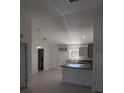 Modern kitchen featuring gray cabinets and an island at 24162 Nw Hemlock Ave, Dunnellon, FL 34431