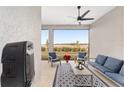 Relaxing screened porch with outdoor furniture and view of open space at 9229 Sw 52Nd Place Rd, Ocala, FL 34481