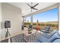 Relaxing screened porch with outdoor furniture and view of open space at 9229 Sw 52Nd Place Rd, Ocala, FL 34481