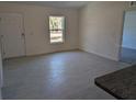 Bright living room with tile floors and access to kitchen at 963 Sw Temple Heights Ct, Dunnellon, FL 34431
