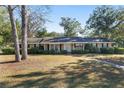 House exterior with a landscaped yard and brick pathway at 1105 Ne 17Th Ne Ter, Ocala, FL 34470