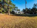 House exterior showcasing a spacious yard at 14515 Ne 110Th Avenue Rd, Fort Mc Coy, FL 32134