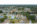 Aerial view showcasing a lovely community with mature trees and well-maintained homes at 8188 Sw 108Th Loop, Ocala, FL 34481