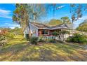 House exterior showcasing a well-maintained lawn and garden at 8637 Sw 97Th Lane Rd # A, Ocala, FL 34481