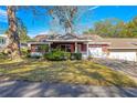 Front view of a single-story house with a stone exterior at 8637 Sw 97Th Lane Rd # A, Ocala, FL 34481