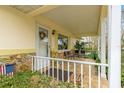 Charming front porch with tiled floor and seating area at 8738 Sw 90Th St # B, Ocala, FL 34481