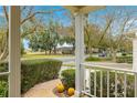 View from the front porch showcases a tree-lined street at 8738 Sw 90Th St # B, Ocala, FL 34481