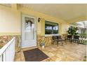 Front porch entry with stonework and a welcoming door at 8738 Sw 90Th St # B, Ocala, FL 34481