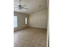 Spacious living room with tile flooring and ceiling fan at 1 Hemlock Circle Way, Ocala, FL 34472