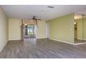 Bright living room featuring tile floors and a sliding glass door at 10882 Sw 62Nd Ave, Ocala, FL 34476