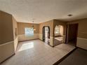 Bright dining room with tile floors and a view of the pool at 10895 Sw 90Th Ter, Ocala, FL 34481