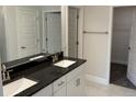 Elegant bathroom features double sinks with granite countertops and tiled floors at 2154 Nw 23Rd Loop, Ocala, FL 34475
