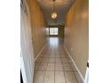 Bright and spacious entryway with tile flooring and a chandelier at 28 Juniper Loop Ter, Ocala, FL 34480