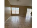 Large living room featuring tile flooring and a ceiling fan at 28 Juniper Loop Ter, Ocala, FL 34480