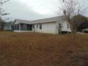 Back of house with screened porch at 4172 Ne 35Th Avenue Rd, Ocala, FL 34479