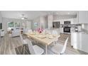 Kitchen and dining area with light wood table and stainless steel appliances at 95 Redwood Rd, Ocala, FL 34472