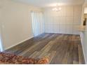 Dining room with vinyl flooring and wainscoting at 100 Sweetgum Woods Ct # 8C, Deltona, FL 32725