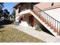 Building exterior showing stairs and entrance at 100 Sweetgum Woods Ct # 8C, Deltona, FL 32725