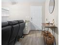 Living room with hardwood floors, sectional sofa, and console table at 12 Pine Trace Pl, Ocala, FL 34472